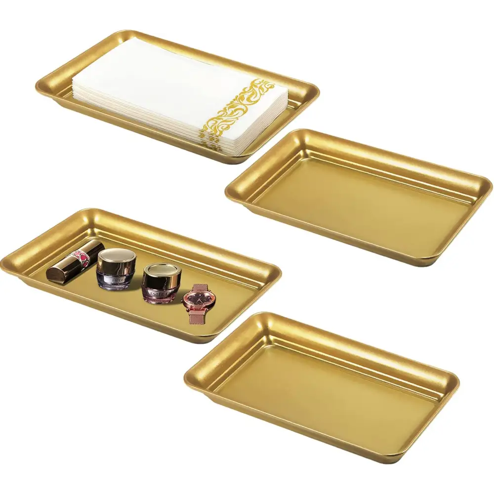 Gold rectangular Vanity Trays with decorative edges and a glass organizer napkin holder