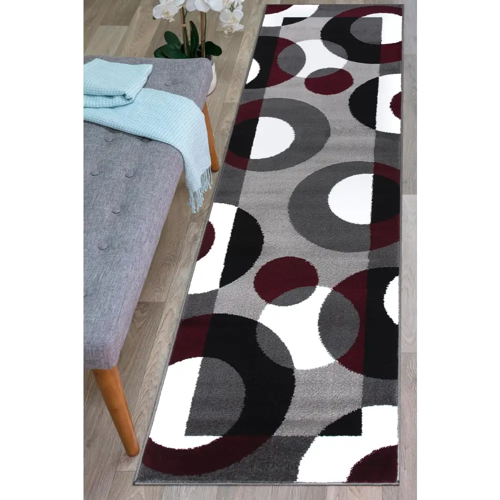 Modern geometric Circles Abstract Rug with dark red, white, and gray circles on a light background