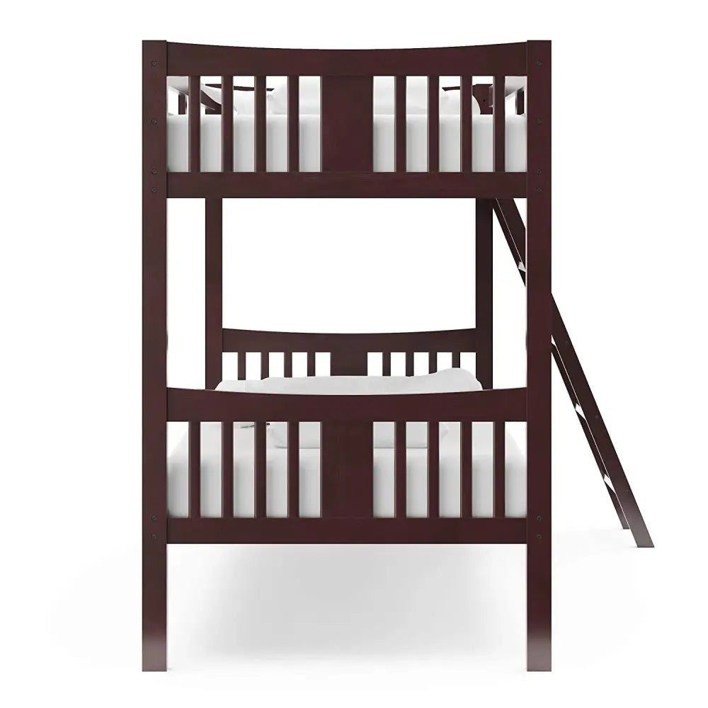 Dark wood Espresso Twin Bunk Bed with Ladder and white bedding featuring a slide