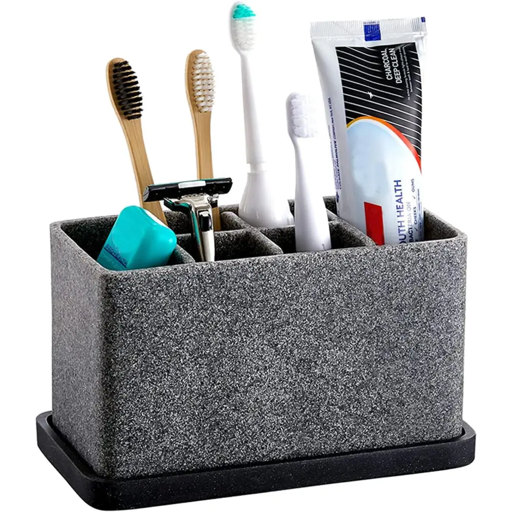 Gray speckled rectangular Marble Toothbrush Holder with black base, toothbrushes, and razor