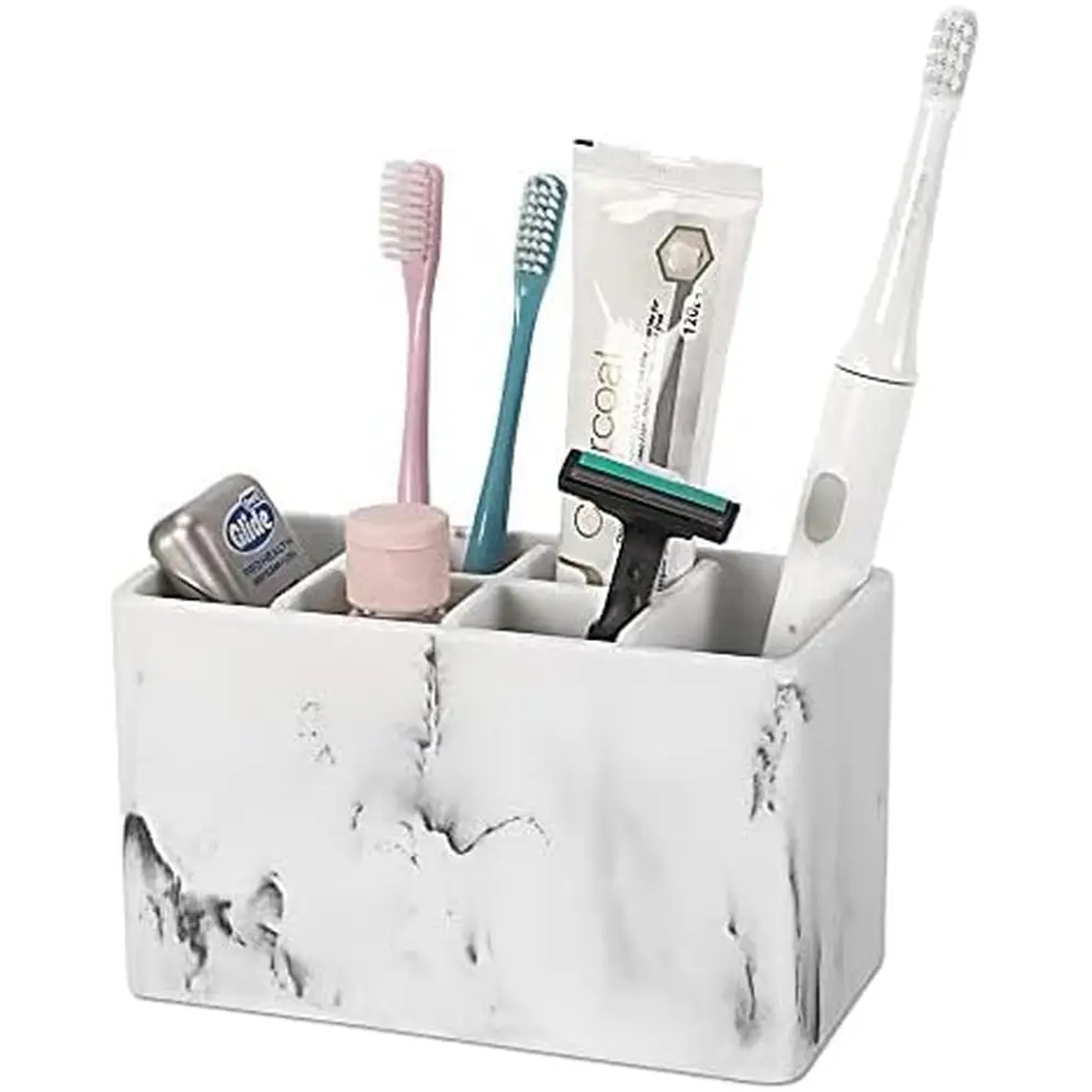 White marble-patterned toothbrush holder with compartments for bathroom essentials