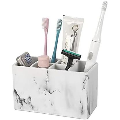 White marble-patterned toothbrush holder with compartments for bathroom essentials