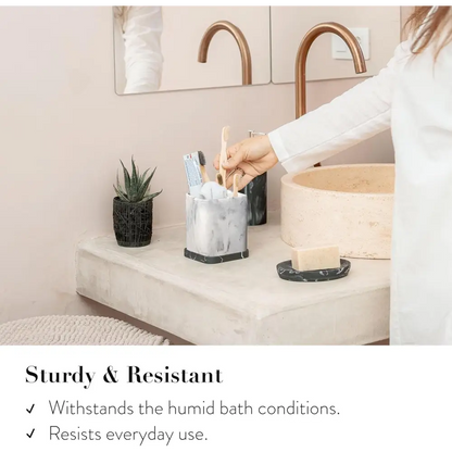 Silver marble toothbrush holder with gold accents and modern sleek design