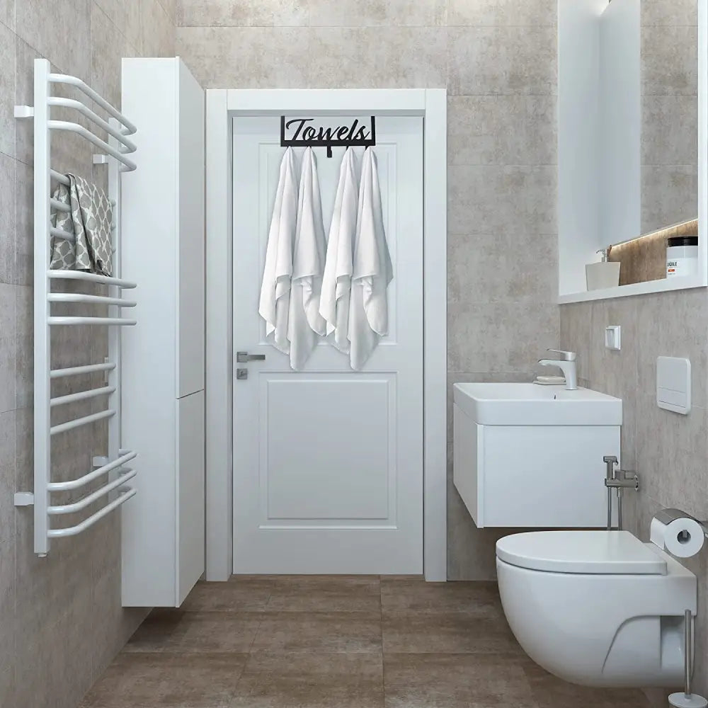 White towel rack with curved bars and modern design for over the door use