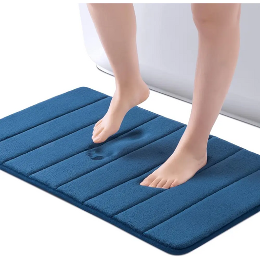 Navy blue ROSMARUS textured memory foam bath mat with non-slip backing for bathroom use