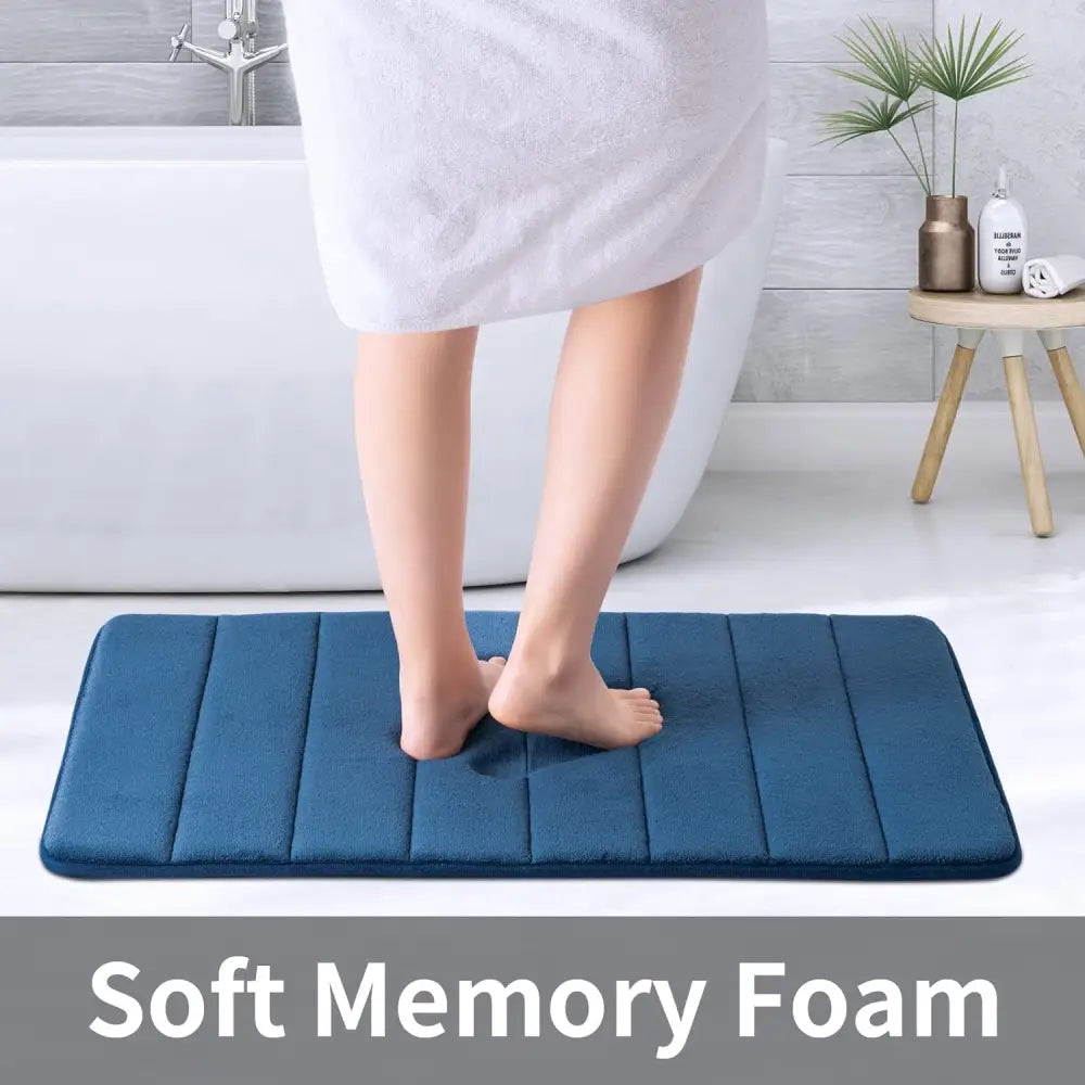 Blue ROSMARUS Navy textured memory foam bath mat with soft cushioning