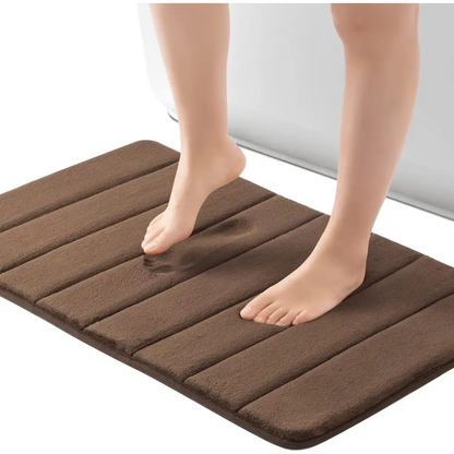 Brown microfiber bath mat with textured stripes and non-slip backing from ROSMARUS Navy collection